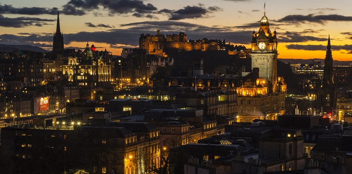 Edinburgh dusk city views. View form calton Hill with monument and Balmoral Hotel clock.
