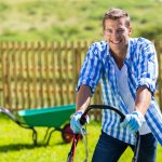 istock happy man mowing lawn